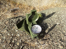 Load image into Gallery viewer, Commenga Lensatic Compass - compaas open on a rock - Wilderness Survival Systems : Picture
